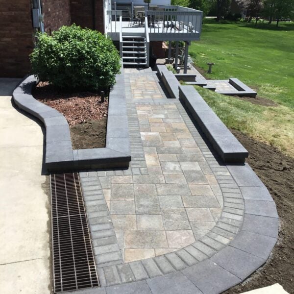 Fendt brick paver curved bordered walkway deck
