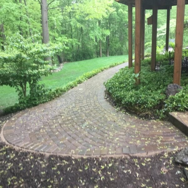 Fendt brick paver curved landscaped path pergola