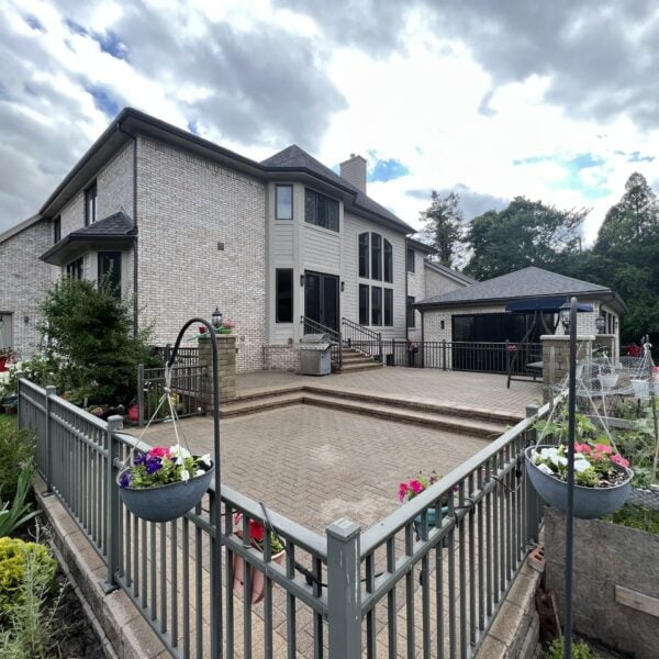 Fendt brick paver gray railed multi level patio