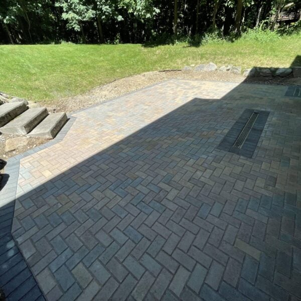 Fendt brick paver herringbone boulder edged entry patio