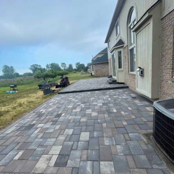 Fendt paver gray stacked side patio construction