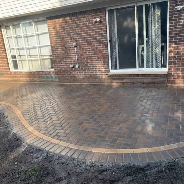 Fendt paver installer curved herringbone patio tan border
